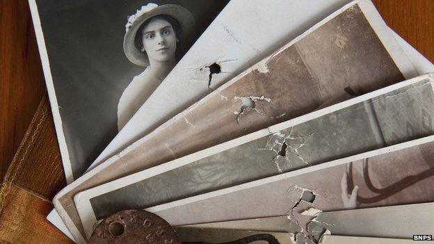 Photos pierced by shrapnel