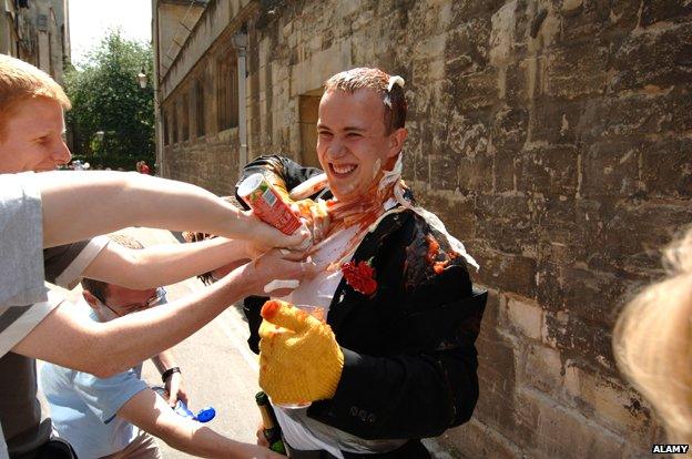 An Oxford University student celebrates the end of finals