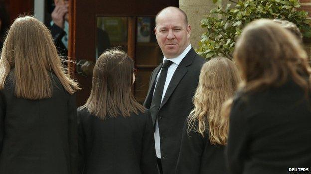 Pupils and head teacher arriving at church