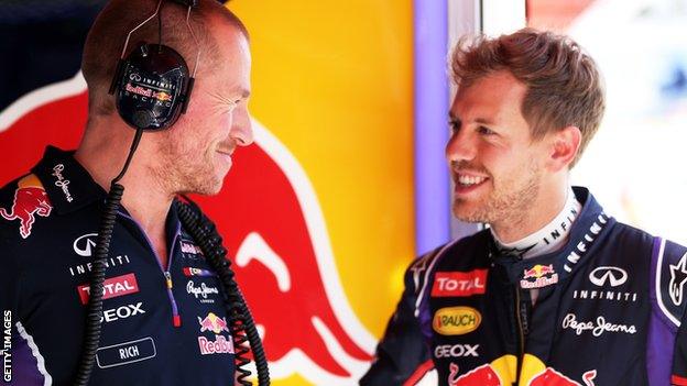 Sebastian speaks with his mechanics during the practice session ahead of the Spanish Grand Prix