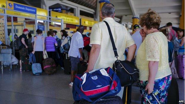 British tourists queue at the check-in at Mombasa airport (16 May 2014)