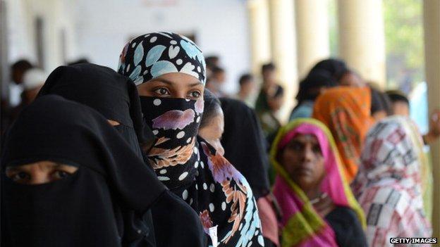 Indian Muslim women arrive at a polling station in Azamgarh, Uttar Pradesh, on 12 May 2014.