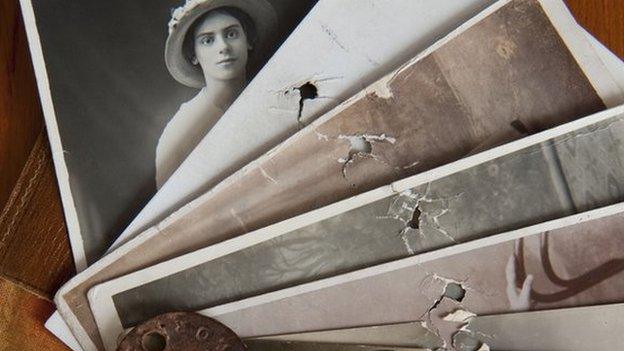 Photos pierced by shrapnel