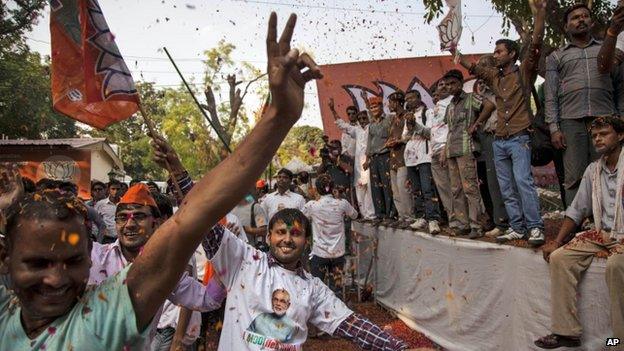 BJP supporters dance to celebrate election results