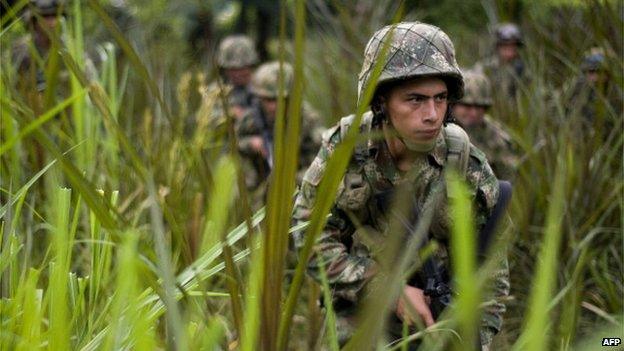 File photo: Colombian soldiers conduct a patrol across a field in a mountainous area in Miranda, Cauca department, Colombia, 18 January 2012