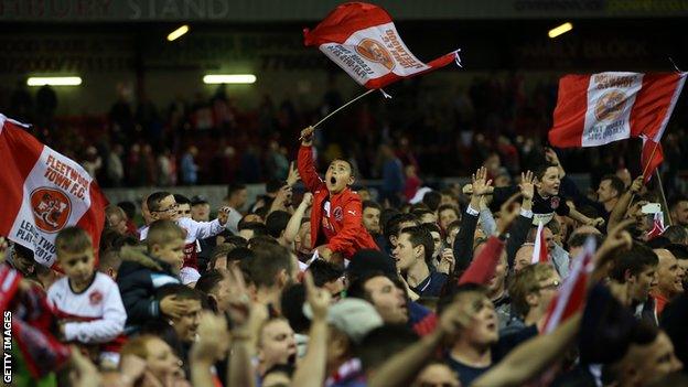 Fleetwood fans celebrate at the final whistle during the Sky Bet League Two play off Semi Final second leg match between Fleetwood Town and York City