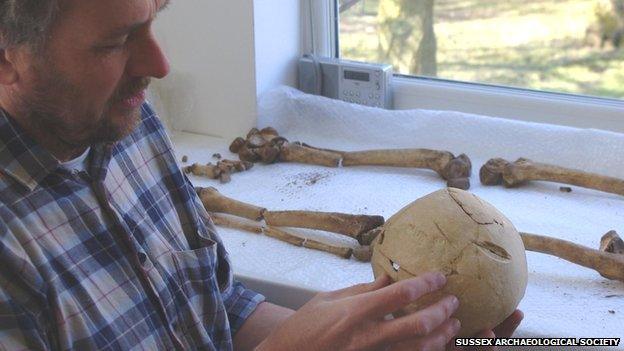 Tim Sutherland examining the skull