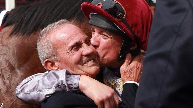 Frankie Dettori plants a kiss on his father Gianfranco's cheek at Newbury