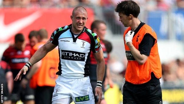 Harlequins winger Mick Brown hobbles off in the Premiership semi-final defeat by Saracens