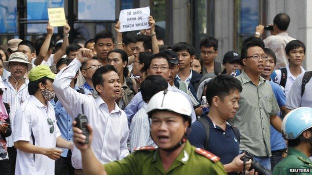 Protesters chant anti-China slogans during an anti-China protest in Ho Chi Minh city on 18 May 2014