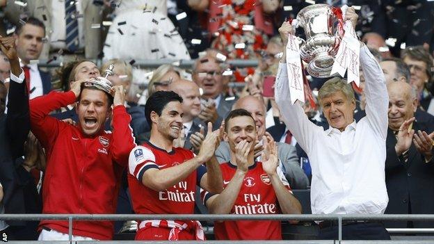 Arsenal managerArsene Wenger lifts the FA Cup