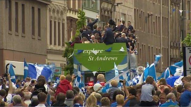 Thousands of people have lined the route of the bus parade