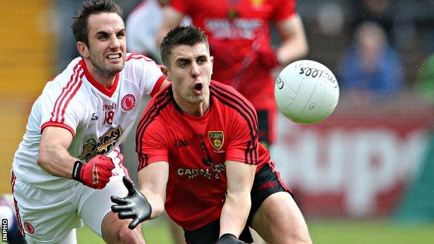 Tyrone's Mark Donnelly moves in on Down opponent Ryan Boyle