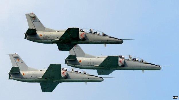 Sri Lankan Air Force aircraft fly in formation during a Victory Day parade in the southern town of Matara, 18 May 2014