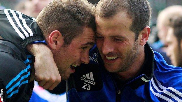 Hamburg skipper Rafael van der Vaart and goalscorer Pierre-Michel Lasogga celebrate the play-off win against Gruether Fuerth