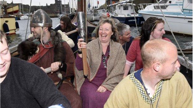 The baton was carried across Peel harbour on a Viking longboat on Sunday