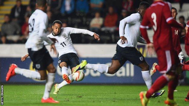 Nathan Redmond of England scores