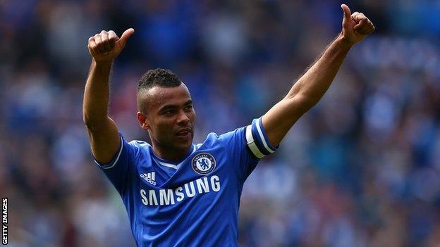 Ashley Cole gives a thumbs up to fans