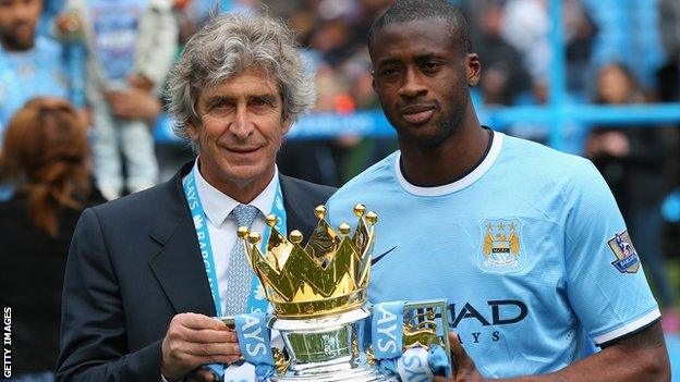 Manchester City manager Manuel pellegrini (left) midfielder Yaya Toure