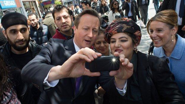 David Cameron takes a "selfie" as he meets local people in Harrow