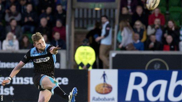 Finn Russell in action for Glasgow