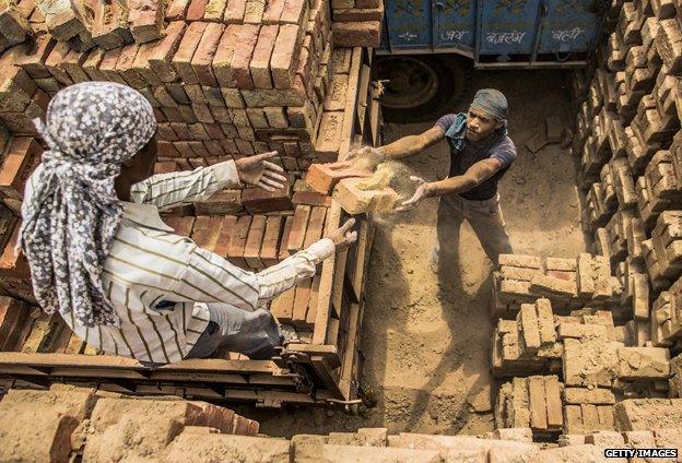 Men making bricks, India