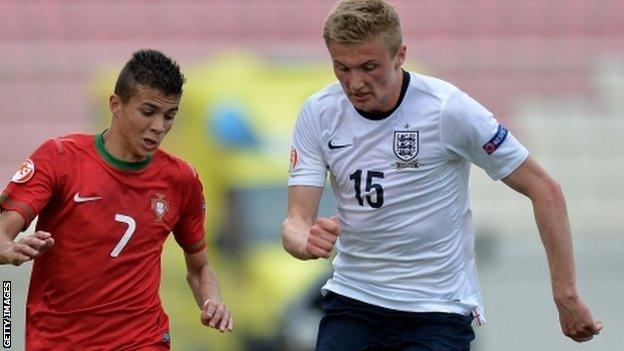 Taylor Moore in action for England (right)