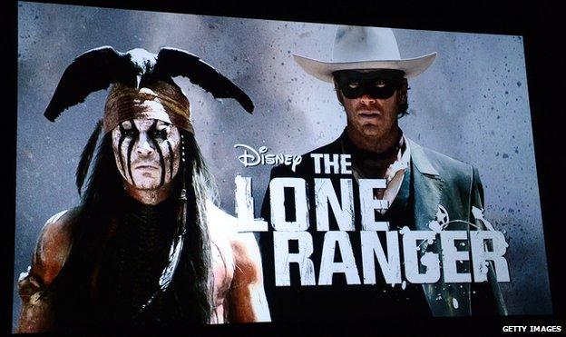 An image on screen during a presentation shows actor Johnny Depp (L) as the character Tonto in the film The Lone Ranger