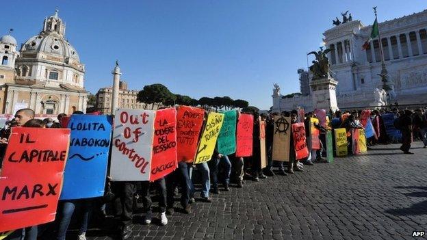 Students and protesters march at Piazza Venezia during a demonstration to protest against the cuts in the education budget and against the austerity measures in Europe on November 17, 2011 in Rome.