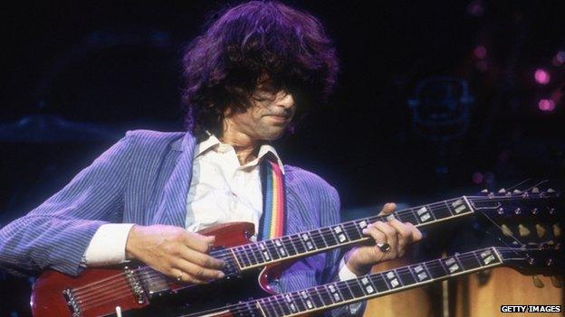 British guitarist and songwriter Jimmy Page, in concert with Led Zeppelin, 1983