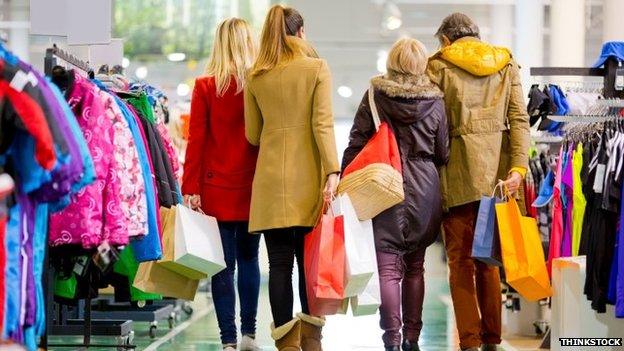 Shoppers in fashion store