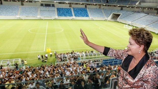 President Dilma Rousseff waves during the inauguration of the Arena Dunas stadium in Natal on 22 January, 2014