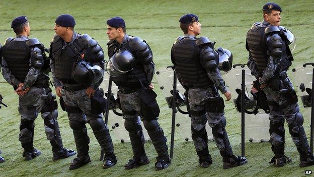 Brazilian soldiers standing outside the Maracana stadium in Rio