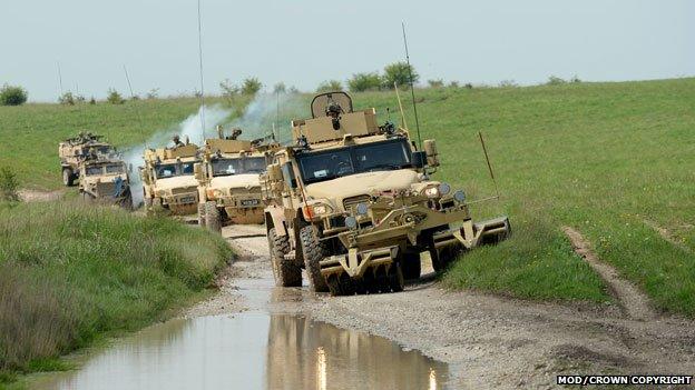 B Company of the Queens Dragoon Guards stage a mounted patrol using Husky and Foxhound vehicles