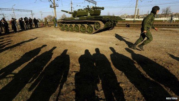 Russian tank crew member and T-72B tank near Simferopol, Crimea