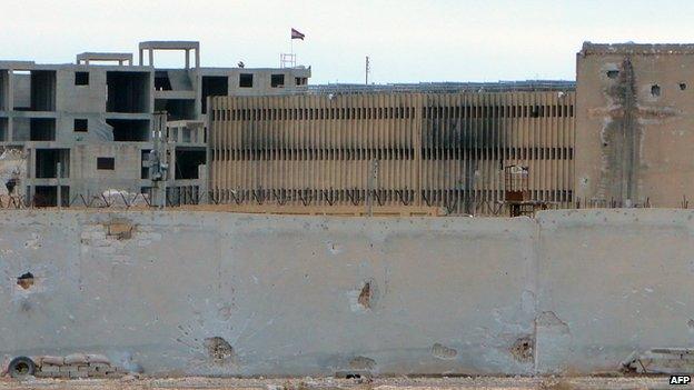 Syrian flag flies from Aleppo Central Prison (6 February 2014)