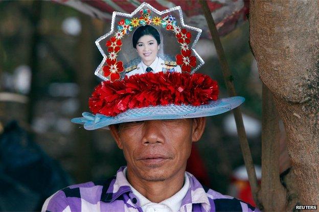 Red shirt supporter with image of ex-PM Yingluck Shinawatra on his hat, Bangkok (22 May)