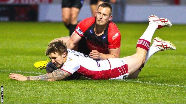 Sam Powell scores a try for Wigan