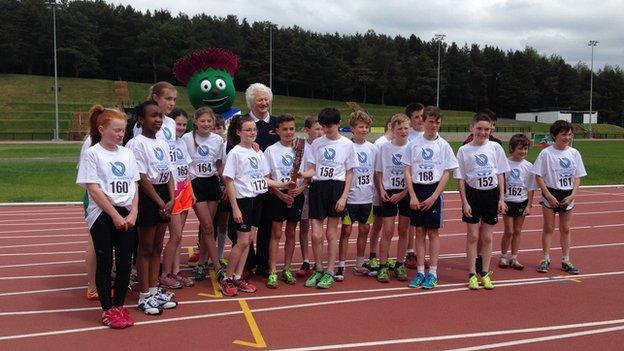 Mary Peters and children with baton relay