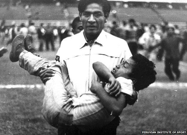 Man carrying injured boy