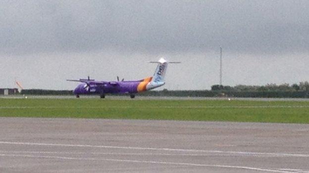 Plane carrying the baton arrivies at Cardiff Airport