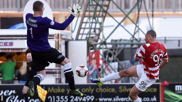 Hibernian goalkeeper Ben Williams saves a shot by Hamilton's Mikael Antoine-Curier