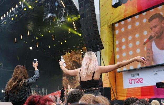Fans watch One Direction