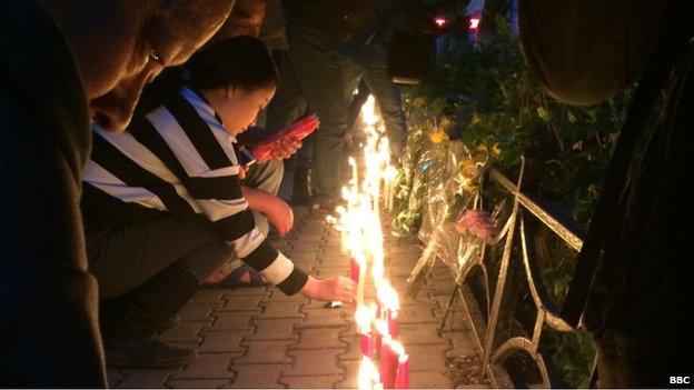 Mourners at memorial for Xinjiang attack victims, Urumqi (23 May)