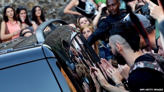 Fans outside Fort Belvedere in Florence, Italy