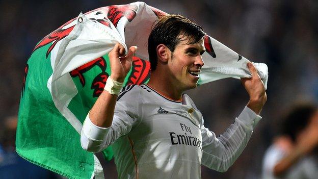 Gareth Bale with the Welsh flag