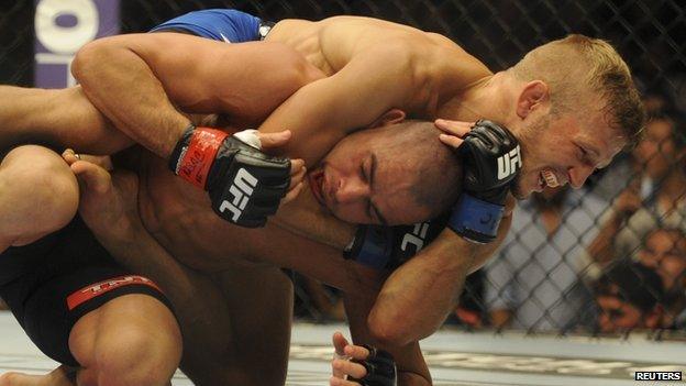 TJ Dillashaw putting Renan Barao in a hold