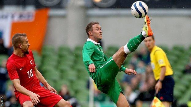 Caner Erkin watches Aiden McGeady in action