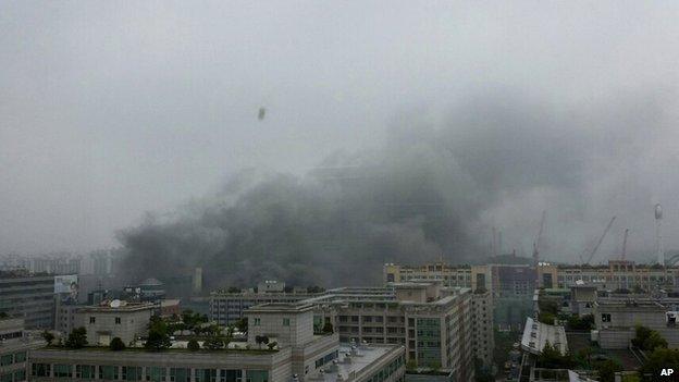 In this photo released by a local resident, smoke rises from a bus terminal at Goyang, north of Seoul, South Korea, on Monday, 26 May, 2014