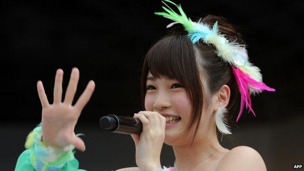 This picture taken on 8 June 2013 shows Japanese girls' pop group AKB48 member Rina Kawaei during the group's concert at the Yokohama stadium.